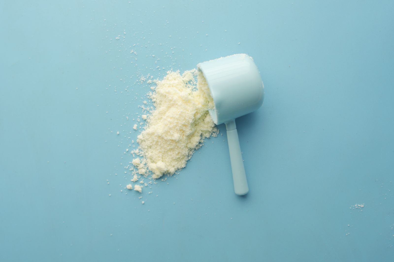 A scoop of clear protein powder.